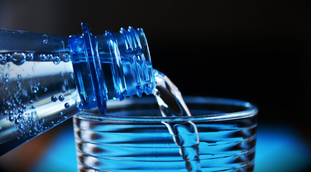 mineral water pouring into a glass